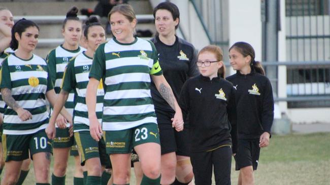 Western Pride captain Meaghan McElligott leads her team on to the field in an earlier NPL match this season at the Briggs Road Sporting Complex. Picture: Christina Moran