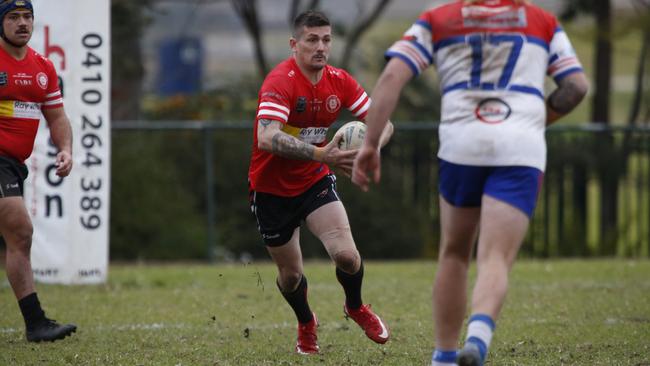 St Clair fullback Robert Henderson charges towards Emu Plains prop Ryan Jervis at Peppertree Sporting Complex in R15. Picture: Warren Gannon Photography