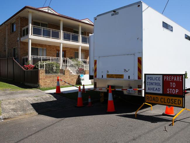 Police at the home of Jay Je Yoon Jung, who lives at home with his parents in Sydney. He is accused of being the man behind the Ghost platform. Picture: NewsWire