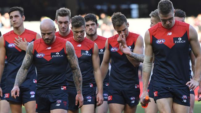 Melbourne players leave the ground after another shock loss. Picture: AAP Image