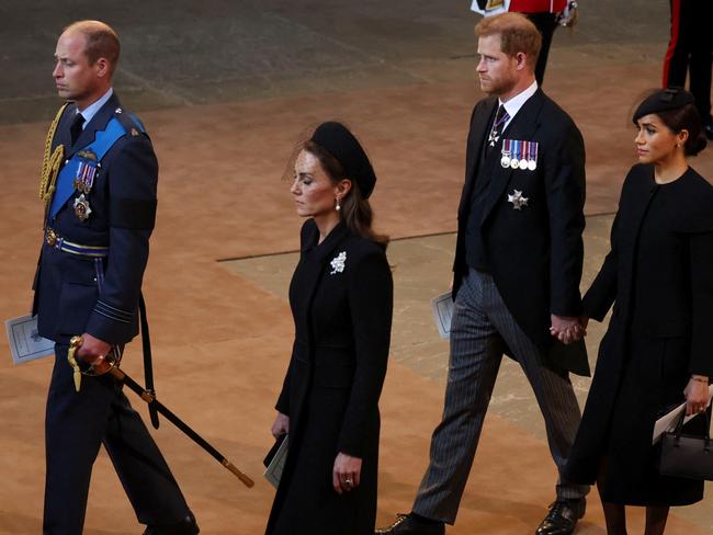 Prince William, Catherine, Princess of Wales, Prince Harry and Meghan Markle walk in a procession with the coffin of the Queen. Picture: Getty Images.