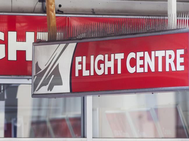 SYDNEY, AUSTRALIA - MARCH 26: A Flight Centre sign is seen on March 26, 2020 in Sydney, Australia. Further restrictions on travel and movement have been put in to place as the federal government works to tackle the spread of COVID-19 across Australia. All international travel is banned, with exceptions for aid workers along with compassionate, work-related and other essential travel. All libraries, museums, galleries, beauty salons, tattoo parlours, shopping centre food courts, auctions, open houses, amusement parks, arcades, indoor and outdoor play centres, swimming pools are closed and indoor exercise activities are now banned. This is in addition to the closure of bars, pubs and nightclubs which came into effect on Monday. Restaurants and cafes are restricted to providing takeaway only. Weddings will now be restricted to five people including the couple while funerals are limited to 10 mourners. All Australians are now expected to stay at home except for essential outings such as work, grocery shopping and medical appointments. Exercising outdoors alone is still permitted. There are now 2676 confirmed cases of COVID-19 in Australia and the death toll now stands at 11. (Photo by Jenny Evans/Getty Images)