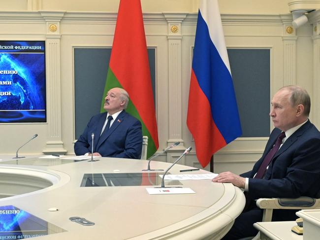 Russian President Vladimir Putin (R) and his Belarusian counterpart Alexander Lukashenko (L) watch training launches of ballistic missiles. Picture: AFP