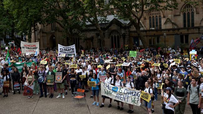 Almost none of the hundreds who turned out to protest left when the rain began to pour. Picture: NCA NewsWire / Damian Shaw