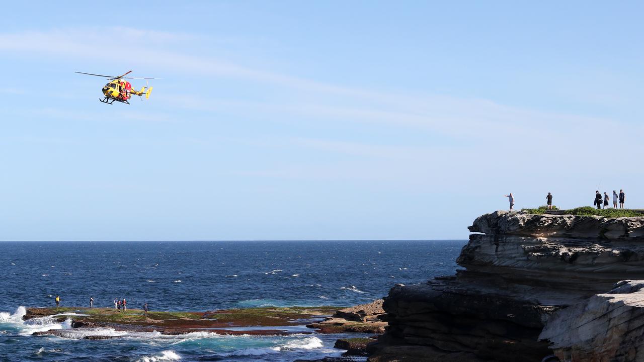 Emergency services at Little bay after a shark attack on Wednesday. Picture: Richard Dobson