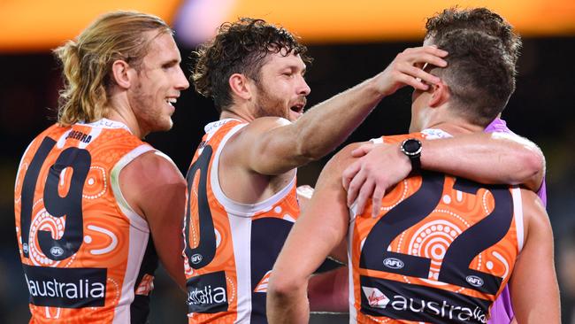 GWS players celebrate their fighting win over Adelaide. Picture: AAP Images