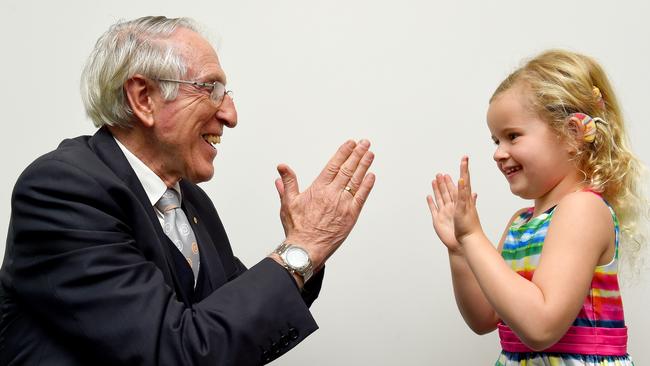 Cochlear creator and founder Professor Graeme Clark with Lily who was fitted with bilateral hearing implants. Picture: Nicole Garmston.