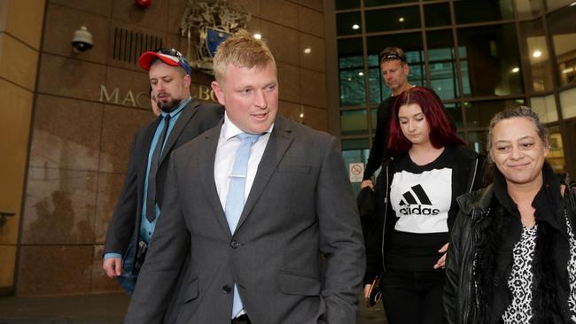 Blair Cottrell with Neil Erikson (left) leaves the magistrates’ court with supporters last month. Picture: Stuart McEvoy.