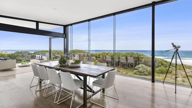 The house is nestled on sand dunes.