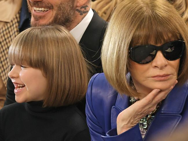 LONDON, ENGLAND - FEBRUARY 17: (L to R) Harper Beckham, David Beckham and Dame Anna Wintour attend the Victoria Beckham show during London Fashion Week February 2019 at Tate Britain on February 17, 2019 in London, England.  (Photo by David M. Benett/Dave Benett/Getty Images)