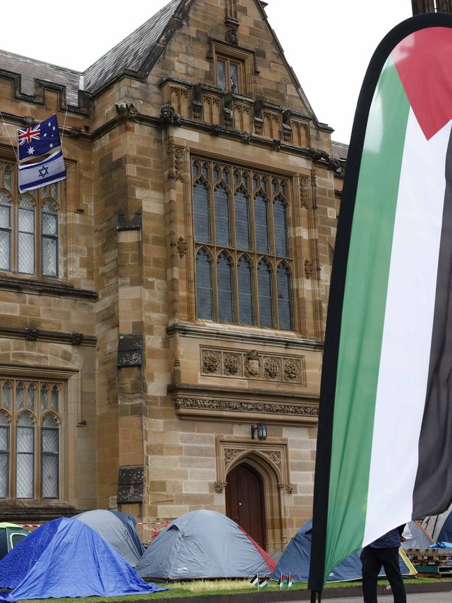 Pro-Israel and pro-Palestine protesters hung banners and flags around the university during the encampment protest. Picture: Richard Dobson