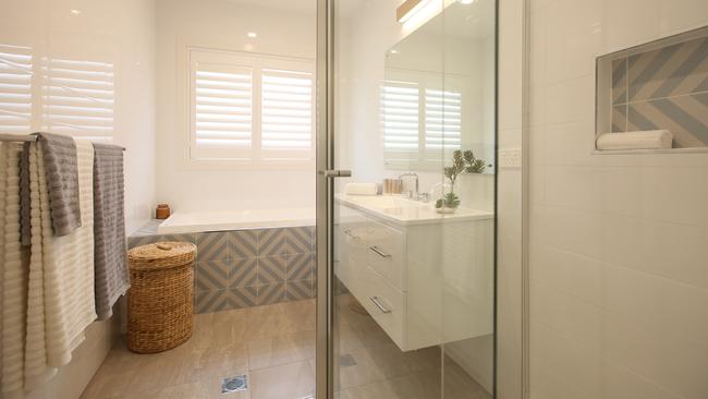 The family bathroom has separate bath and shower