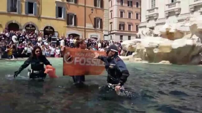 Climate activists turn Rome’s Trevi Fountain black