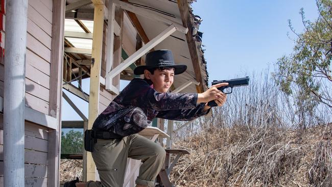 12 year old Quinn Coates-Marnane prepares to compete in a practical pistol event at the Mareeba Pistol club in far north Queensland.