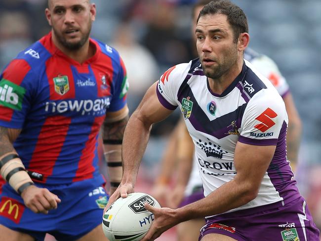NEWCASTLE, AUSTRALIA - JULY 17: Cameron Smith of the Storm looks to pass the ball during the round 19 NRL match between the Newcastle Knights and the Melbourne Storm at Hunter Stadium on July 17, 2016 in Newcastle, Australia. (Photo by Tony Feder/Getty Images)
