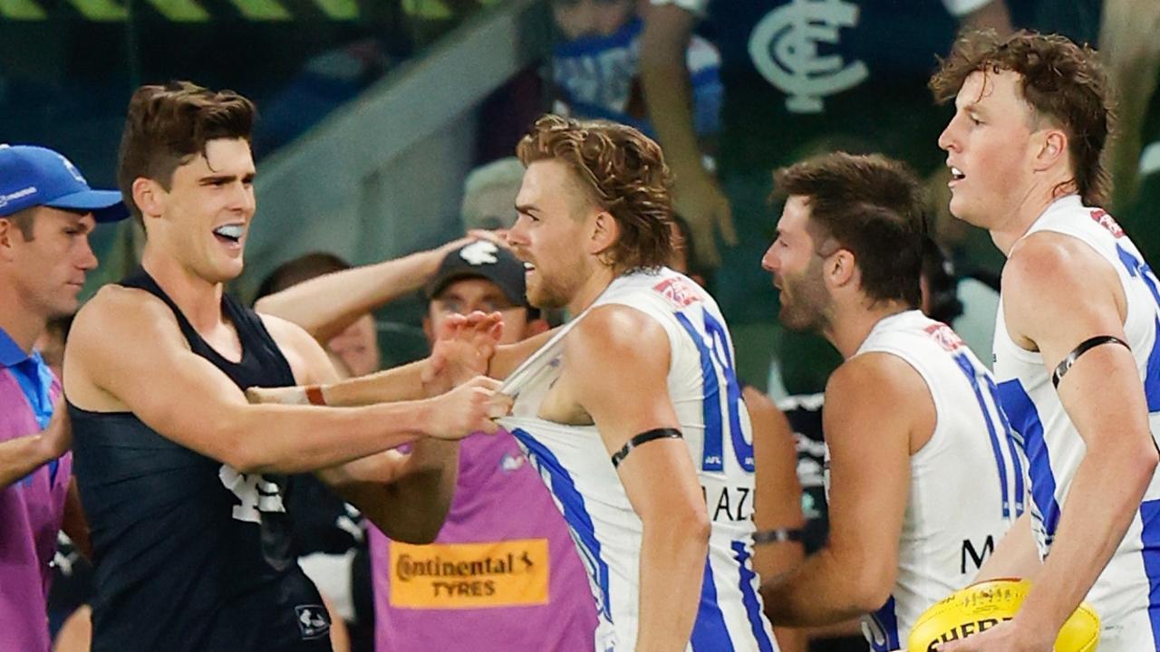 Lewis Young of the Blues and Hugh Greenwood of the Kangaroos wrestle. Photo by Michael Willson/AFL Photos via Getty Images.