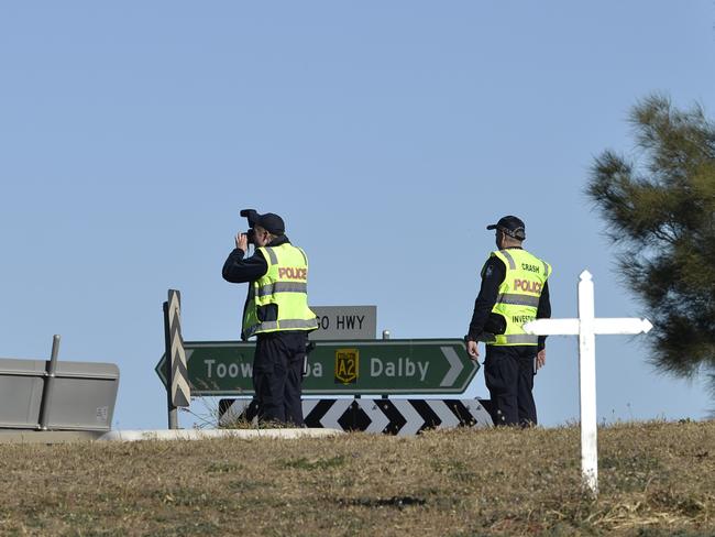 Police Forensic Crash Unit (FCU) officers at the scene of a fatal car and truck crash at intersection of  Warrego Hwy and Toowoomba Rd, Oakey, Sunday, May 3, 2020. Picture: Kevin Farmer