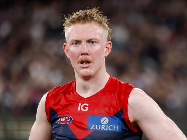 MELBOURNE, AUSTRALIA - SEPTEMBER 15: Clayton Oliver of the Demons looks dejected after a loss  during the 2023 AFL First Semi Final match between the Melbourne Demons and the Carlton Blues at Melbourne Cricket Ground on September 15, 2023 in Melbourne, Australia. (Photo by Dylan Burns/AFL Photos via Getty Images)