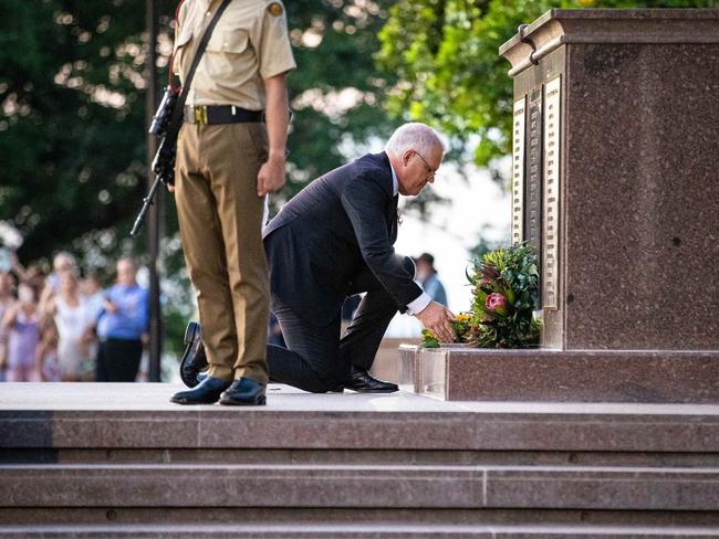 Scott Morrison laying a wreath at the Darwin Cenotaph War Memorial. Picture: Jason Edwards