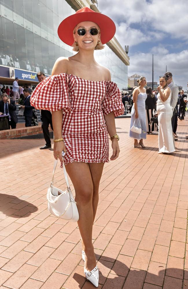 A racegoer braves the chilly temperatures. Picture: Getty Images