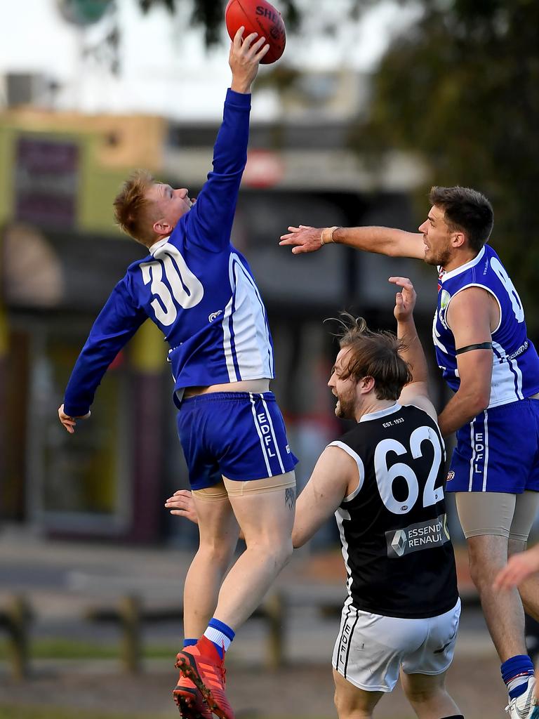 Essendon District: Coburg Districts’ Nicholas Heales does his best Roy Cazaly impression against Moonee Valley. Picture: Andy Brownbill