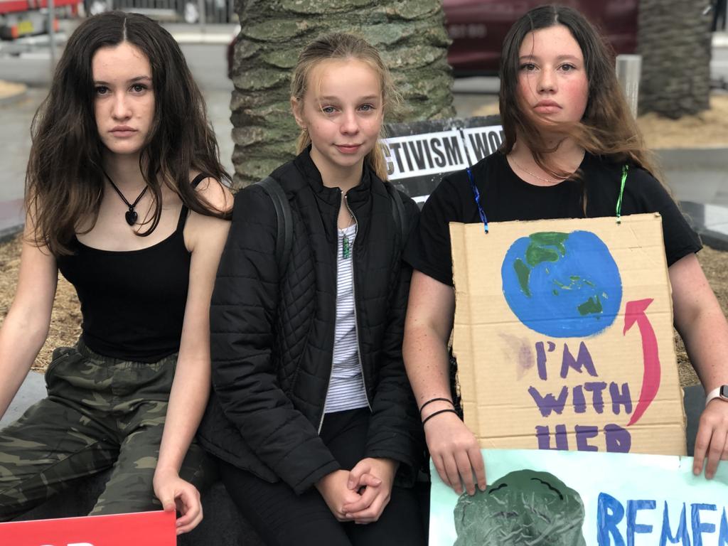 Estella Brasier, 14, Keisha Davis, 15, and Coco Norris, 13, attend the protest in Cronulla.