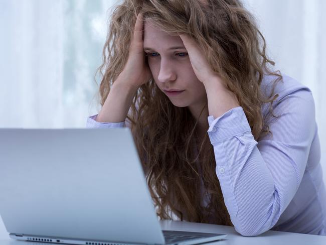 CYBER BULLY  Image of despair girl humilated on internet by classmate