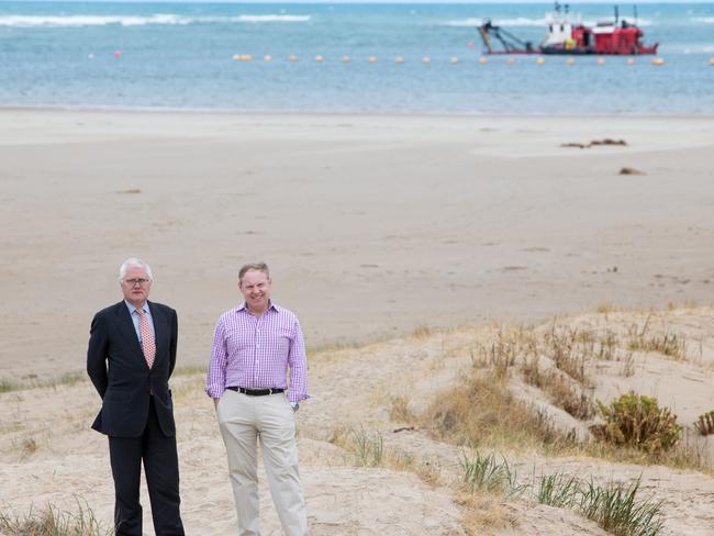 Murray-Darling Basin Royal Commissioner Bret Walker and senior counsel Richard Beasley with the backdrop of a dredger at the Murray mouth. Picture: Leon Mead