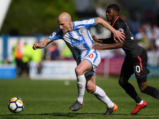 Aaron Mooy gets a step ahead of his Arsenal opponent. Picture: Getty Images