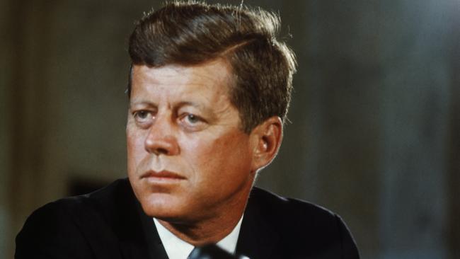 The magic bullet theory contends that a single bullet passed through the neck of Kennedy, far left, from behind, entered the right shoulder of John Connally, the governor of Texas, seated in front of him, exiting through his right rib into his right wrist before turning to embed itself in his left thigh. Picture: Getty