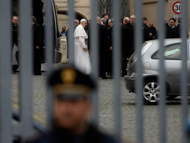 A policeman stands guard as Pope Francis and other Vatican officials prepare to leave the Vatican. Picture: AFP