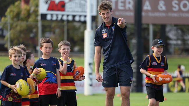 Crows young gun Billy Dowling with junior footballers during a Gather Round clinic at Stratarama Stadium. Picture: Dave Mariuz