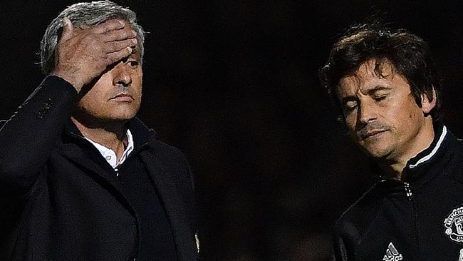 Manchester United's Portuguese manager Jose Mourinho (L) and assistant Rui Faria.