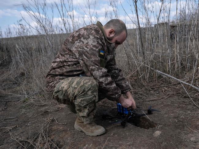 A Ukrainian serviceman prepares to launch a FPV drone. Picture: AFP