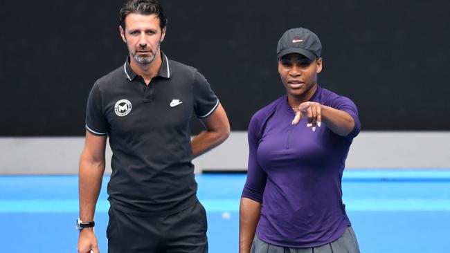 Serena Williams on court with her coach Patrick Mouratoglou during a practice session at the Australian Open in Melbourne, Sunday, Jan. 15, 2017. (AAP Image/Tracey Nearmy) NO ARCHIVING