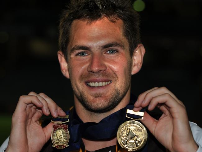 Luke Hodge wearing his 2008 premiership and Norm Smith Medals.