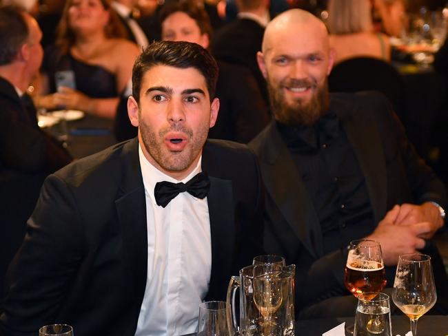 MELBOURNE, AUSTRALIA – SEPTEMBER 25: Christian Petracca and Max Gawn of the Demons react during the 2023 Brownlow Medal at Crown Palladium on September 25, 2023 in Melbourne, Australia. (Photo by Morgan Hancock/AFL Photos via Getty Images)