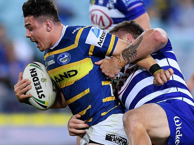 Reed Mahoney of the Eels is tackled by Greg Eastwood of the Bulldogs during the Round 19 NRL match between the Parramatta Eels and the Canterbury-Bankstown Bulldogs at ANZ Stadium in Sydney, Thursday, July 19, 2018. (AAP Image/Dan Himbrechts) NO ARCHIVING, EDITORIAL USE ONLY