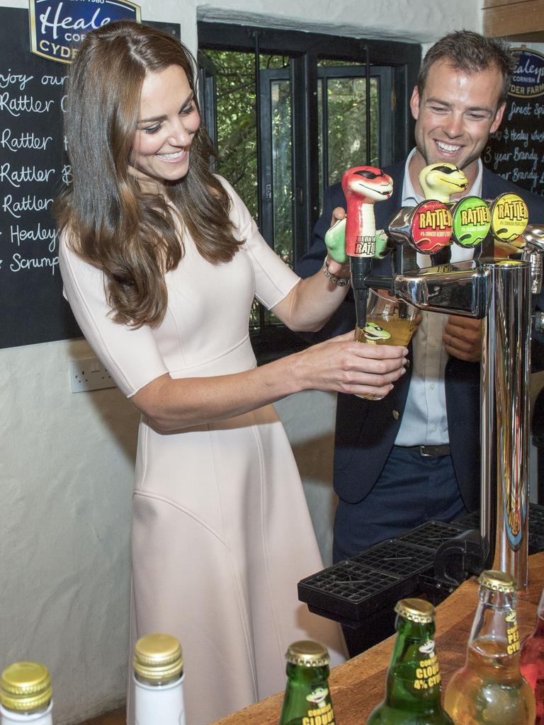 Catherine, Duchess of Cambridge has a go at pouring a pint as she visits Healey’s Cornish Cider Farm, a thriving local business celebrating its 30th anniversary and one of the area’s top tourist attractions on September 1, 2016 in Truro, United Kingdom. Picture: Getty