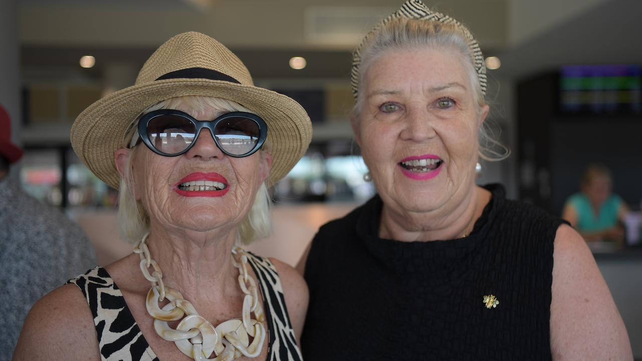 Sisters Lee Bird up from the Gold Coast and local Julie Kozaris reunite at the Darwin Races after four years. Picture: (A)manda Parkinson