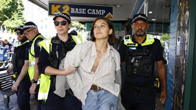 A pro Palestine supporter is arrested by police during the Labour Day march in Brisbane after throwing an egg towards Queensland Premier Steven Miles. Picture: NCA NewsWire/Tertius Pickard