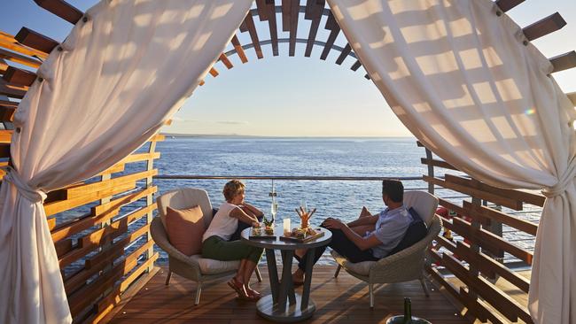 Sunset drinks in a private cabana on board.