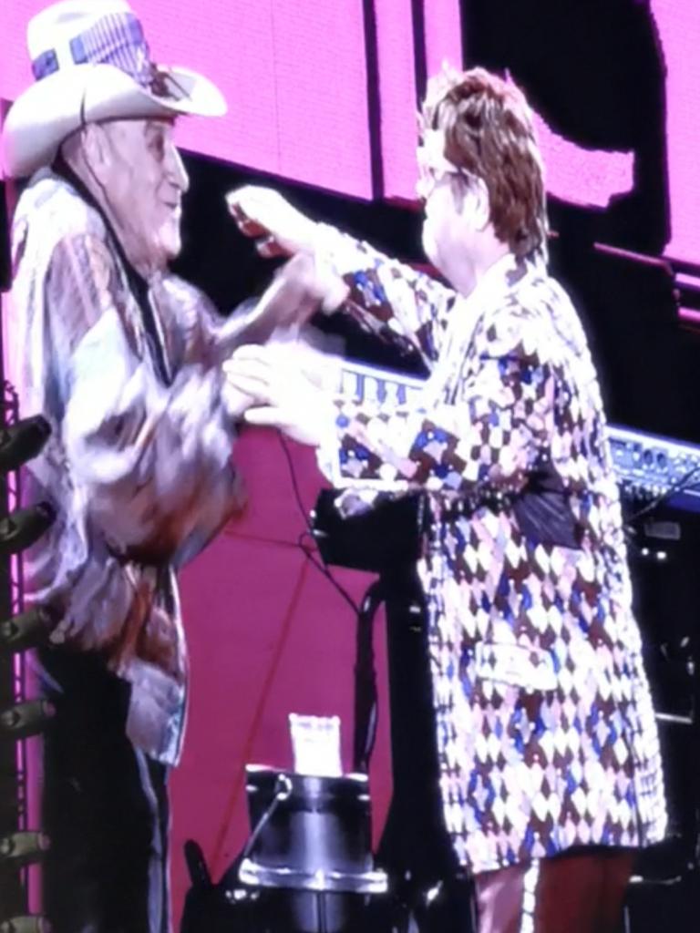 Molly Meldrum onstage with Elton John.