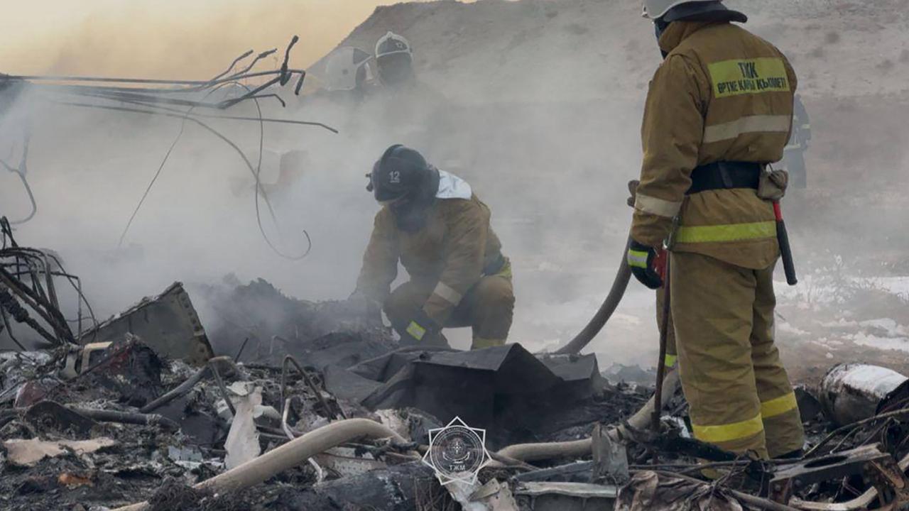 Emergency specialists work at the crash site of an Azerbaijan Airlines passenger jet near the western Kazakh city of Aktau on December 25, 2024. Picture: AFP.