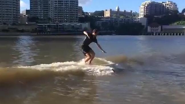 Man surfs in Brisbane River