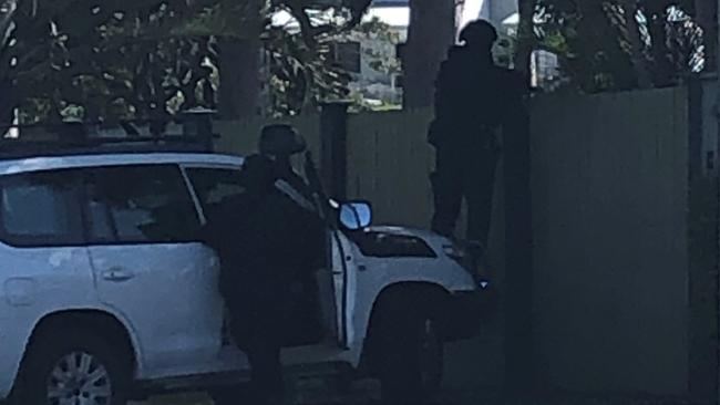 Multiple heavily-armed police attended the raid on Plucks Rd. Photo: Kara Sonter