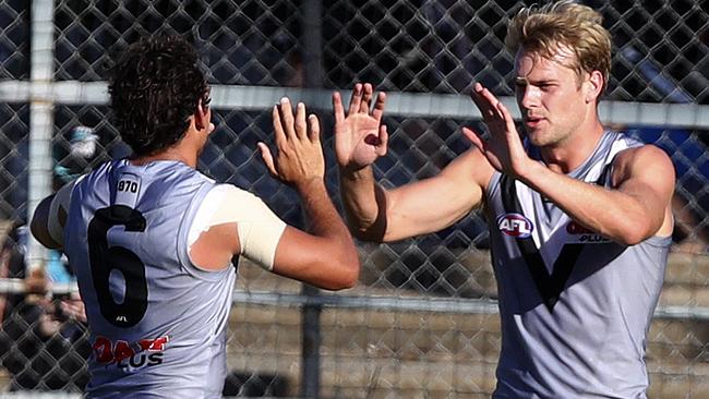 Port Adelaide’s Jack Watts celebrates with Steven Motlop. Picture: SARAH REED