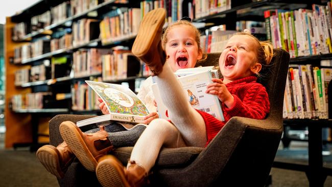 Twins Margot and Mabel Lund, 3, at The Civic Library, Woodville. Picture: Mike Burton