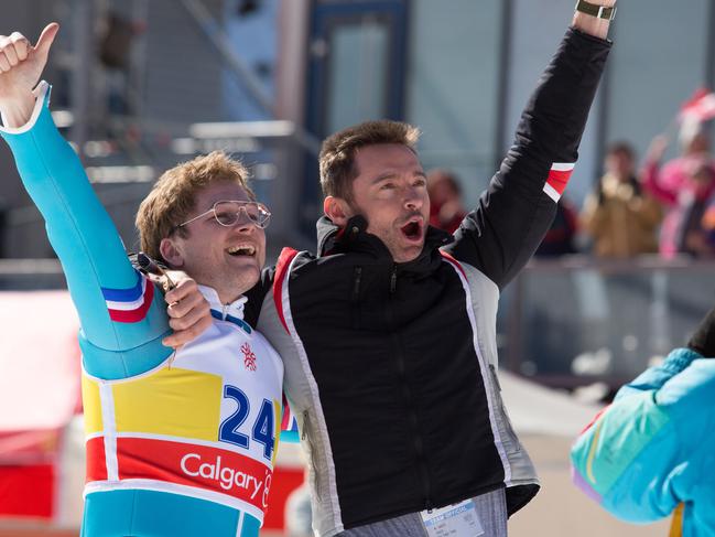 Hugh Jackman and Taron Egerton in a scene from the movie Eddie the Eagle. 20th Century Fox.