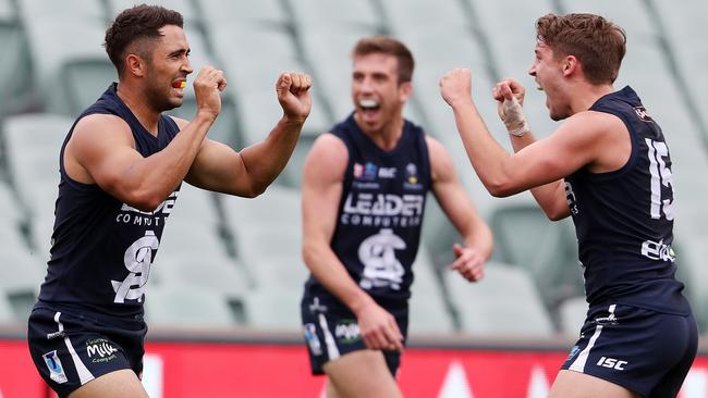 Malcolm Karpany celebrates his goal with Luke Bogle and Joel Cross. Picture: Sarah Reed